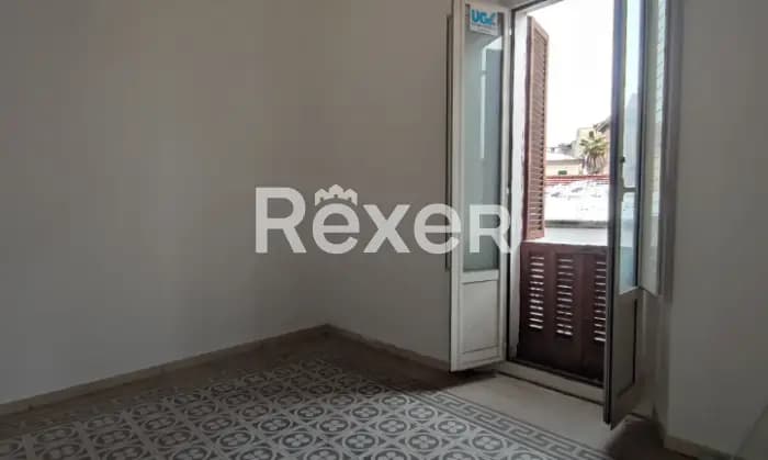 Rexer-Sulmona-Appartamento-con-due-camere-da-letto-camino-balcone-cantina-CameraDaLetto