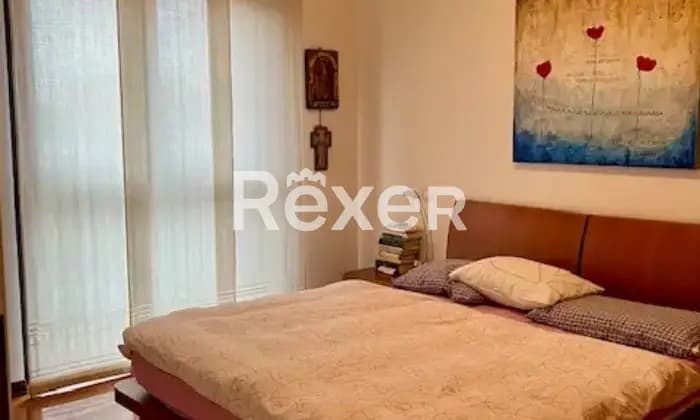 Rexer-Settimo-Milanese-Vendesi-panoramico-e-luminoso-appartamento-con-bagni-CameraDaLetto