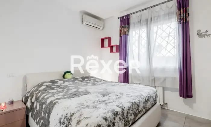 Rexer-Roma-Infernetto-Appartamento-con-giardino-CameraDaLetto